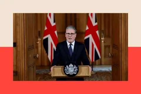 Getty Images Keir Starmer delivers a statement inside No 10 Downing Street, standing at a lectern in front of two flags