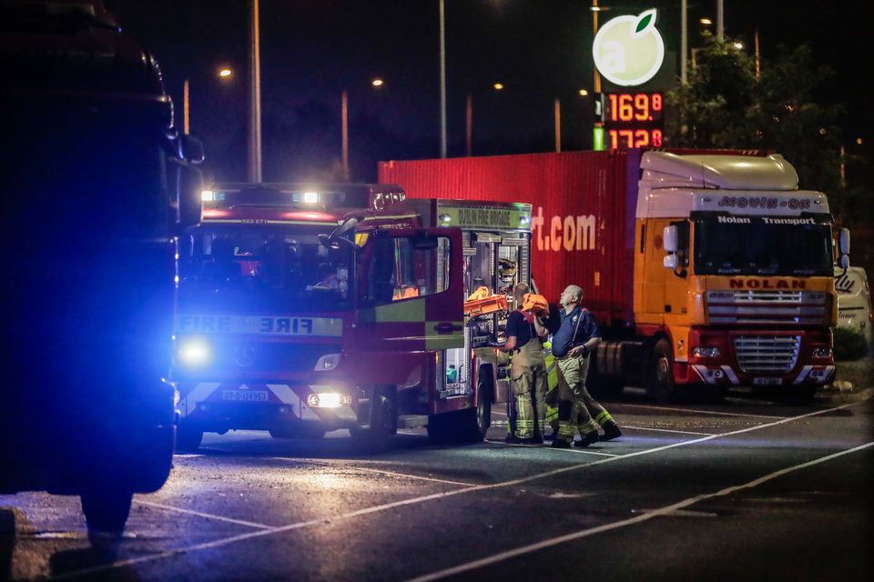 Firefighters at the scene of a fatal crash on the N7 westbound near Rathcoole in Dublin after an articulated truck collided with two cars. The truck driver was pronounced dead at the scene. Photo: Damien Storan.