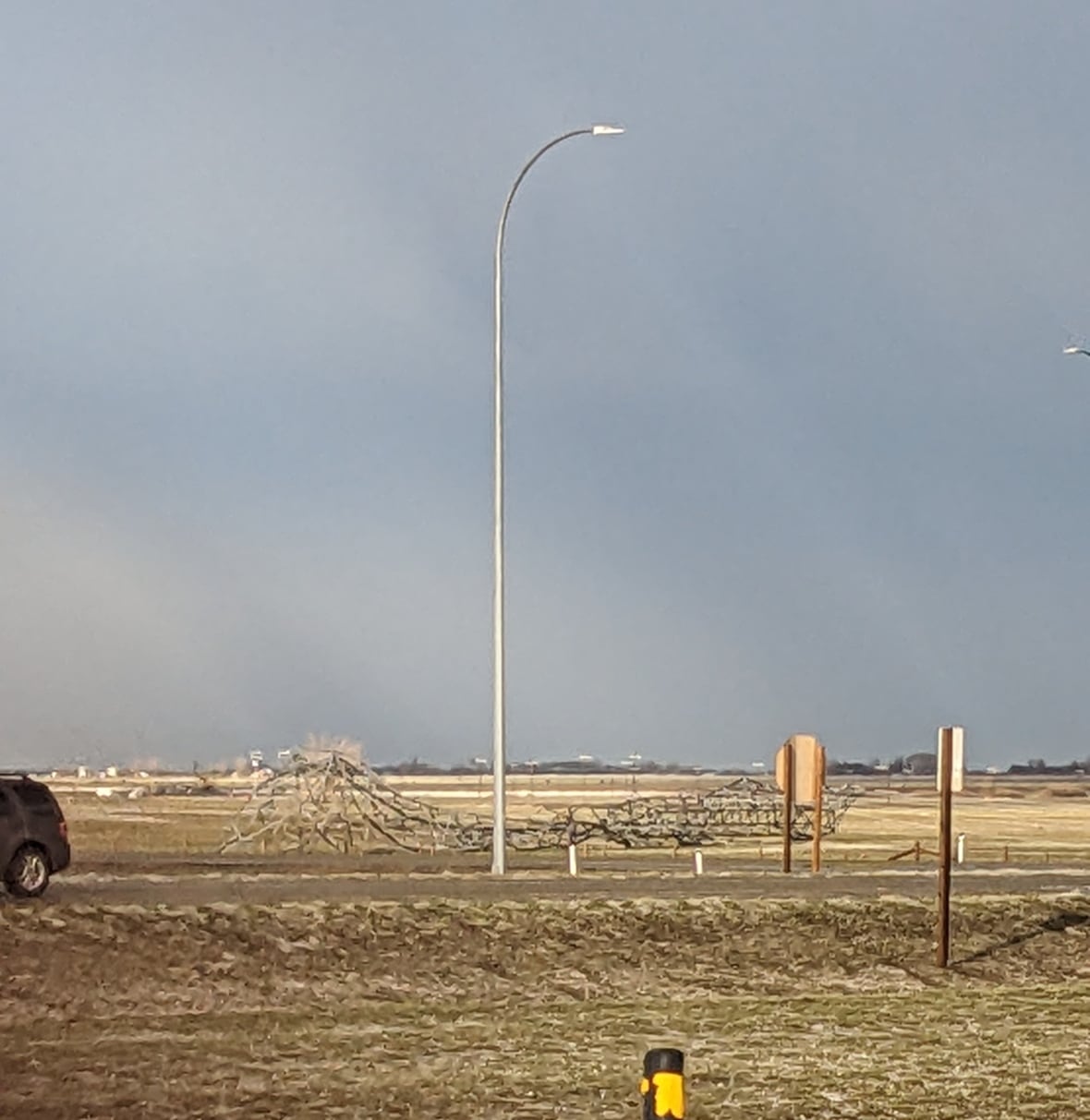 Downed power lines and damaged cars, leading to some road closures, were reported by RCMP around Brooks, Alta. on Wednesday evening.