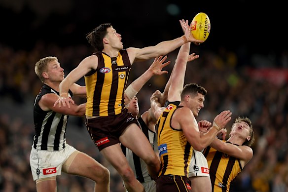 Mitch Lewis of the Hawks competes for the mark.