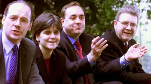 PA Media Alex Salmond led his party - and close colleagues John Swinney, Nicola Sturgeon and Michael Russell - into the Scottish Parliament in 1999