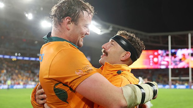 Harry Wilson of the Wallabies embraces teammate Nic White after the team's victory.