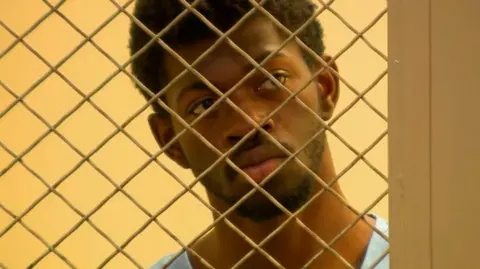 CBS Rapper Lil Nas X is seen in court wearing a jail uniform