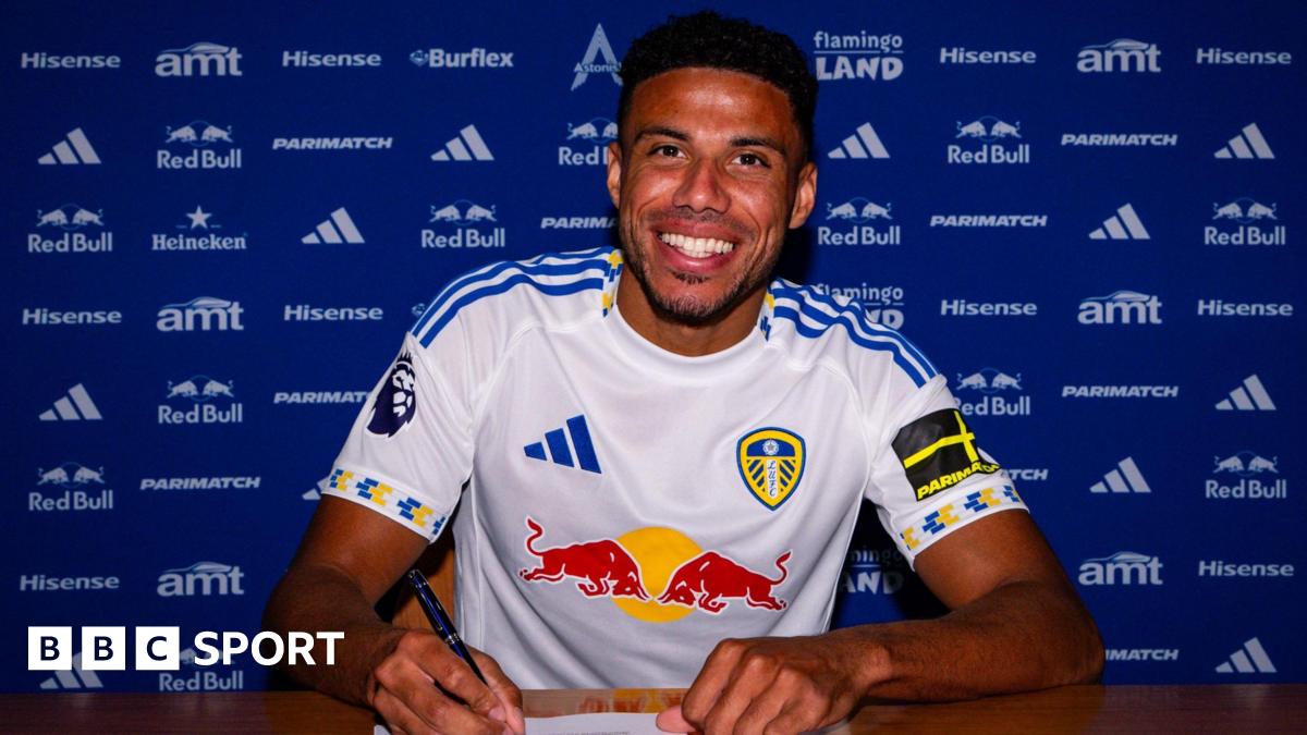 James Justin signing his Leeds contract