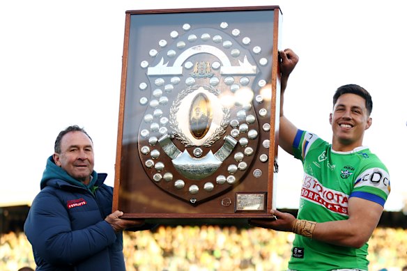 Raiders coach Ricky Stuart and Joseph Tapine of the Raiders pose with the JJ Giltenan Shield after winning the minor premiership.
