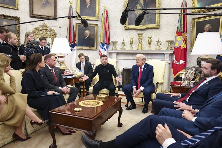 Ukrainian president Volodymyr Zelensky, gestures as he talks with US president Donald Trump and his aides, including US vice-president J.D.Vance at the White House.