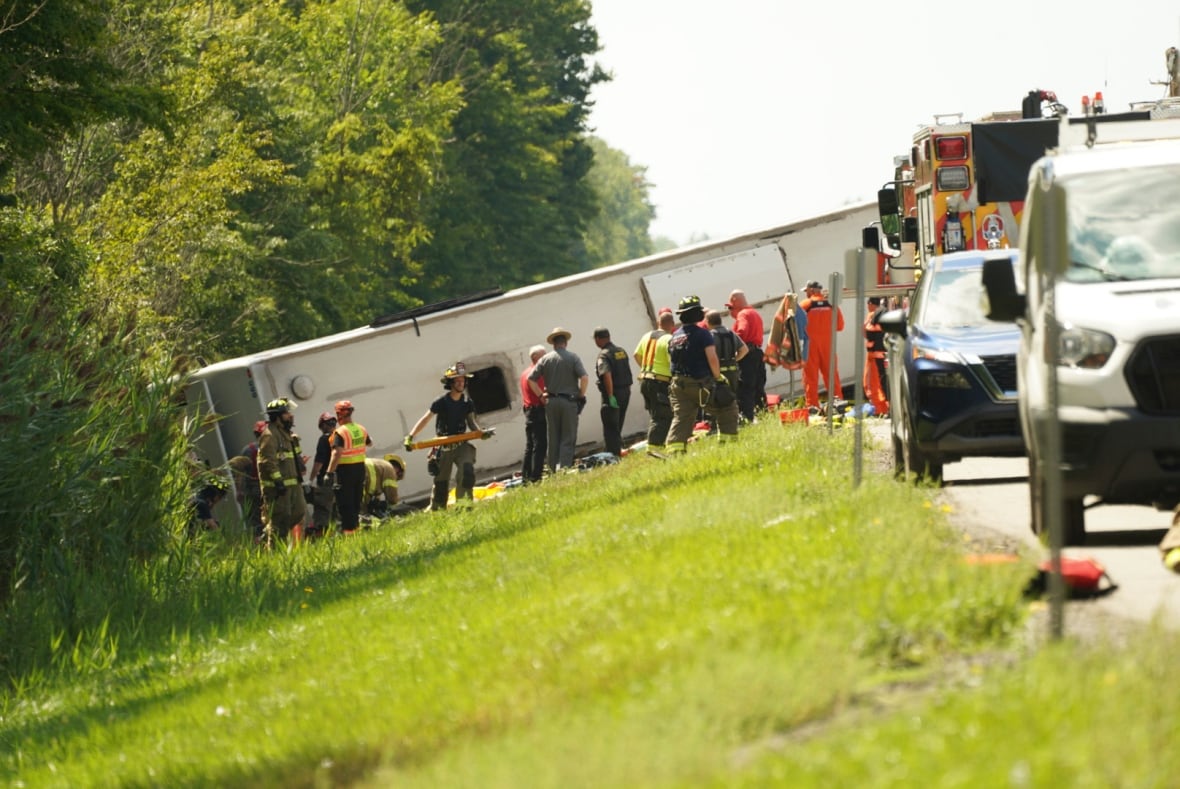 First responders are seen at the site of a deadly bus crash on the New York State Thurway, which occurred near Pembroke, N.Y., on Aug. 22, 2025.