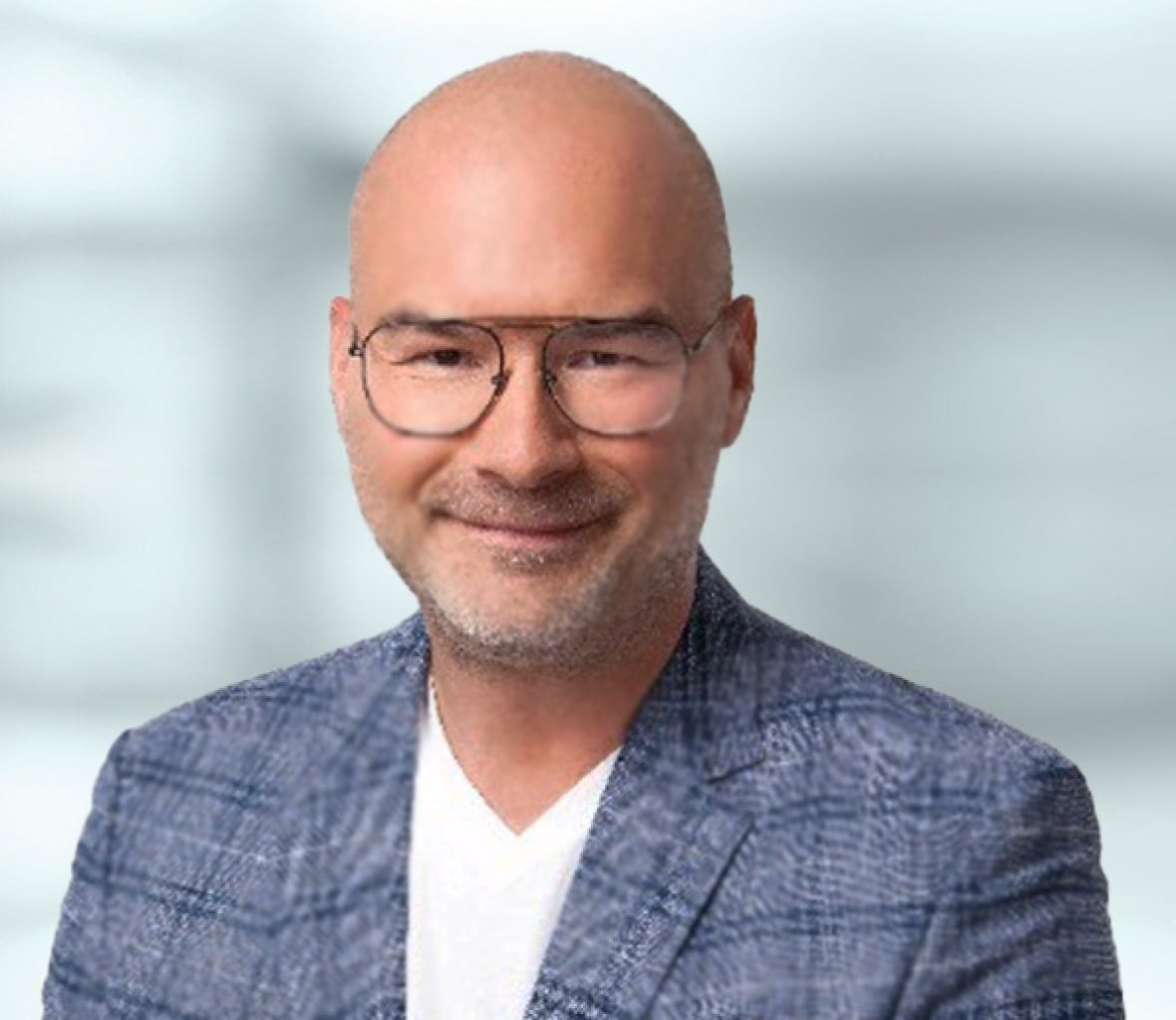 A bald man with glasses.