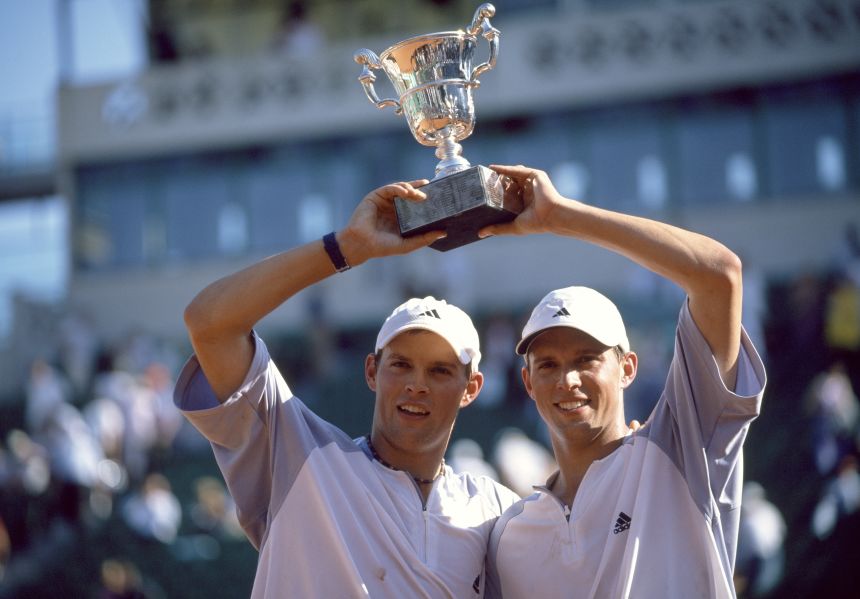 Michael Bryan and Bob Bryan lift the trophy after their win in the men's doubles final of the French Open in 2003.