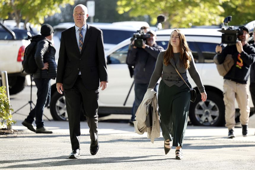 Simon Patterson (L) arrives at Latrobe Valley Magistrates' Court where Erin Patterson was on trial in Morwell in May 2025.