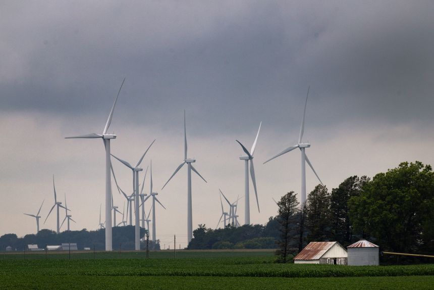 Power generating wind turbines tower over the rural landscape near Pomeroy, Iowa, on July 5.