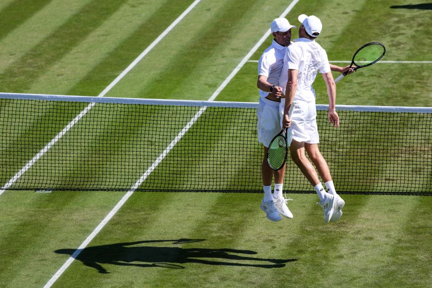 The Bryan brothers celebrate victory in the Gentlemen Invitation Doubles Round Robin match at Wimbledon 2025 on July 8.