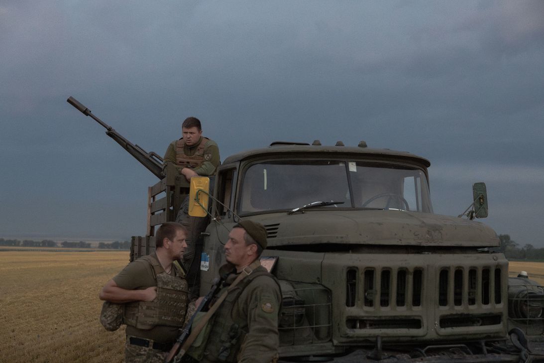 Ukrainian serviceman wait next to a military truck during a Russian air attack near Pavlograd, Dnipropetrovsk, Ukraine, on July 19.