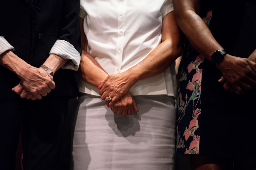 Chair of the Illinois Democratic Party Lisa Hernandez, center, stands alongside Texas state representatives during a news conference in Aurora, Illinois, on Tuesday.