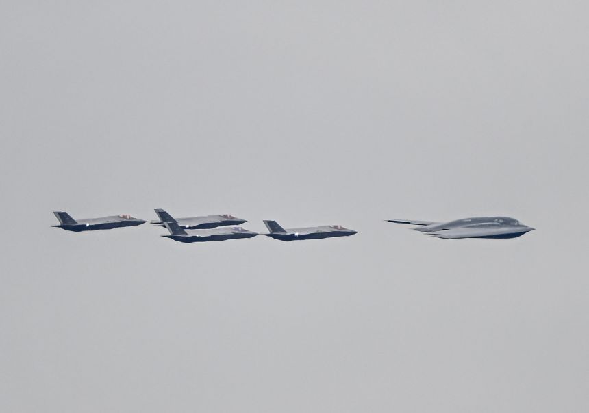 F-35 jets and a B-2 bomber accompany the plane carrying the Russian President Vladimir Putin as he arrives at Elmendorf-Richardson Joint Base ahead of Russian President Vladimir Putin and US President Donald Trump meeting in Alaska, United States on August 15, 2025.