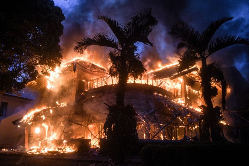 The People's Consultative Assembly of the Republic of Indonesia (MPR-RI) official guesthouse burns after being set on fire during a protest in Bandung, West Java, today.