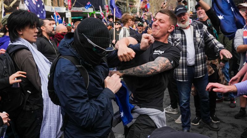 Clashes as thousands rally against immigration in Australia, in protests government has linked to neo-Nazis
