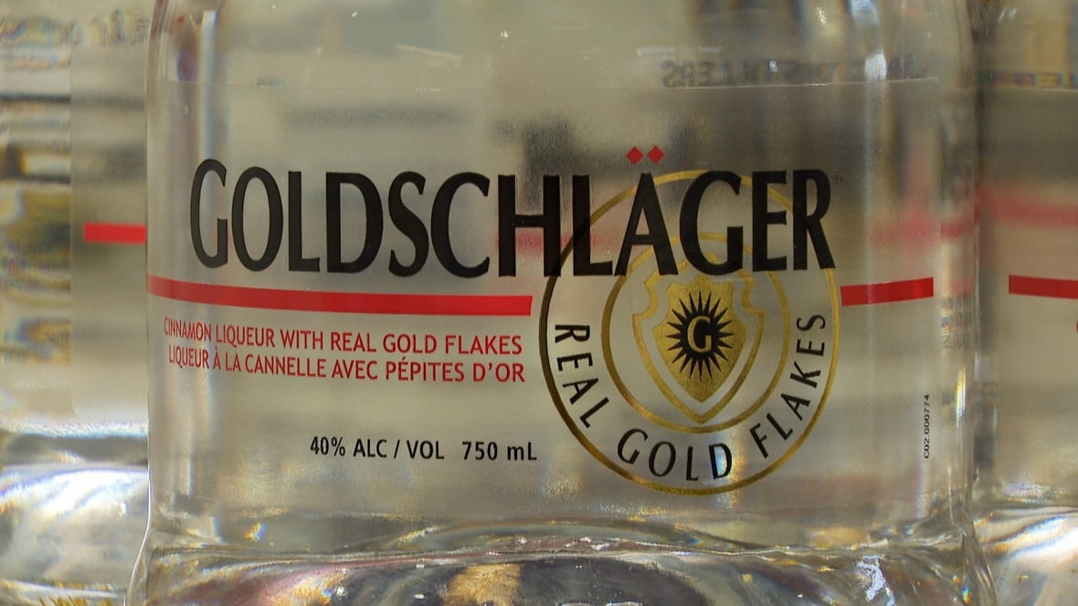 A bottle of Goldschläger, a type of cinnamon schnapps, is shown on an NSLC shelf.