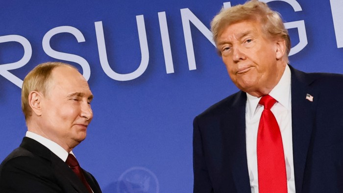 Donald Trump stands beside Vladimir Putin at a press conference, both wearing suits and red ties against a blue backdrop