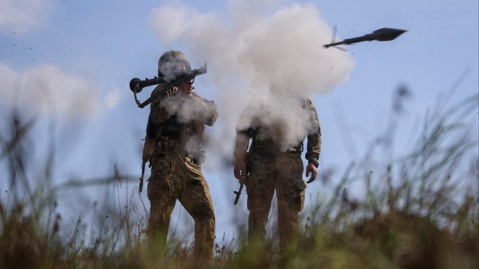 Servicemen of the 115th Separate Mechanized Brigade of the Ukrainian Armed Forces use an RPG-7 grenade launcher during training