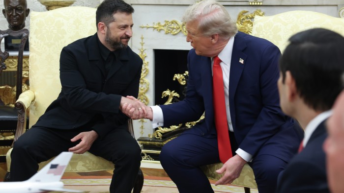 US President Donald Trump shakes hands with Ukrainian President Volodymyr Zelenskyy during a meeting in the Oval Office at the White House on August 18 2025 in Washington