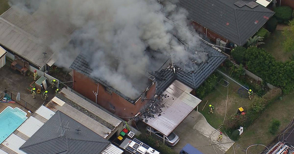 Firefighters battle to control house fire in western Sydney
