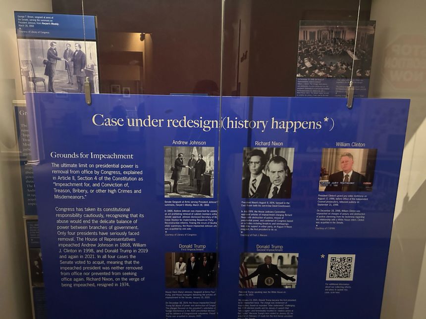 In September 2021, the Smithsonian placed a board over the exhibit which read: “Case under redesign (history happens*)” and referenced Trump’s two impeachments.