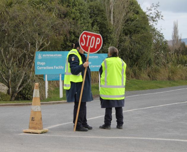 Corrections staff block the entrance to the Otago Corrections Facility. Photo: Nick Brook