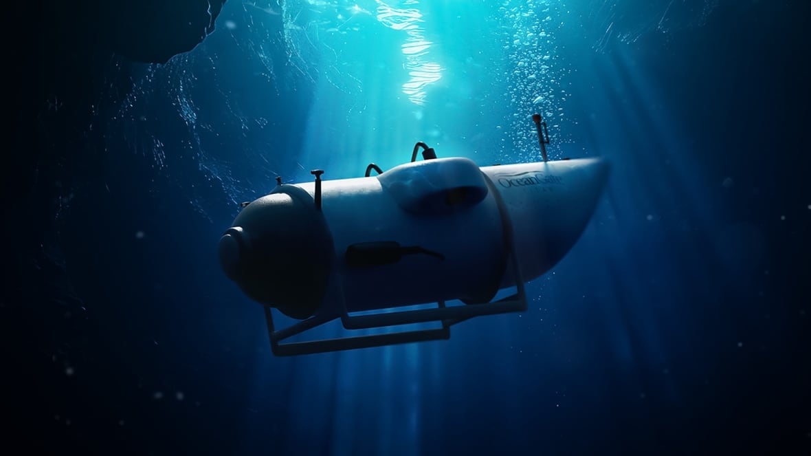 An image of the Titan submersible descends into the dark depths as sunlight streams down from the surface above. 