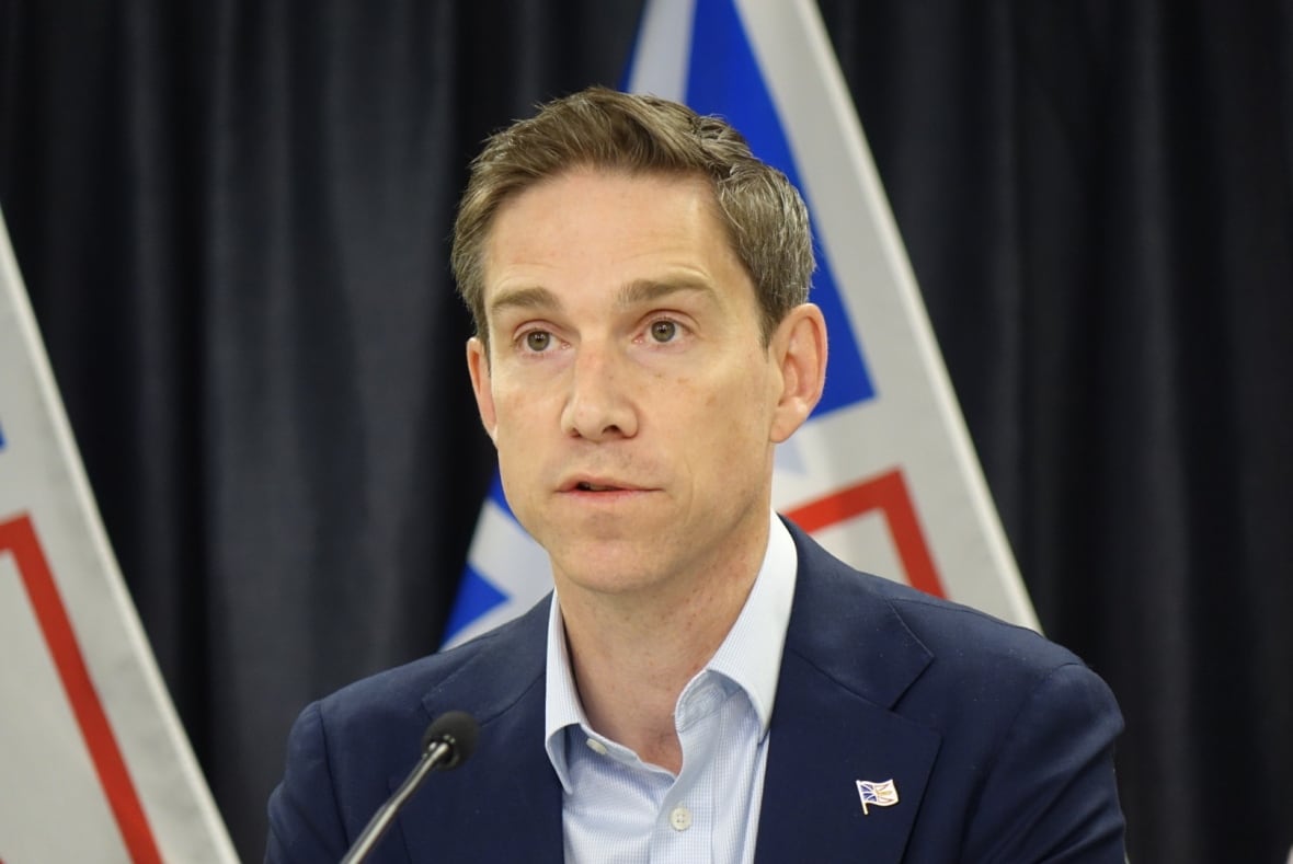 Man in suit looking serious.