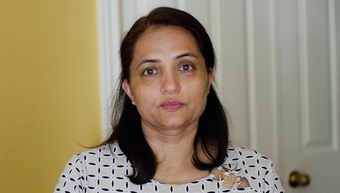 Close up photo of Kiranjit Kaur in front of a neutral background. 