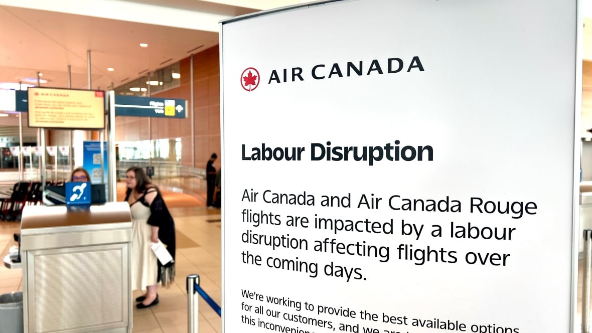 A white sign with black lettering