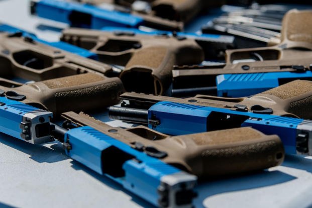 Sig Sauer M18 pistols rest in simulation configuration