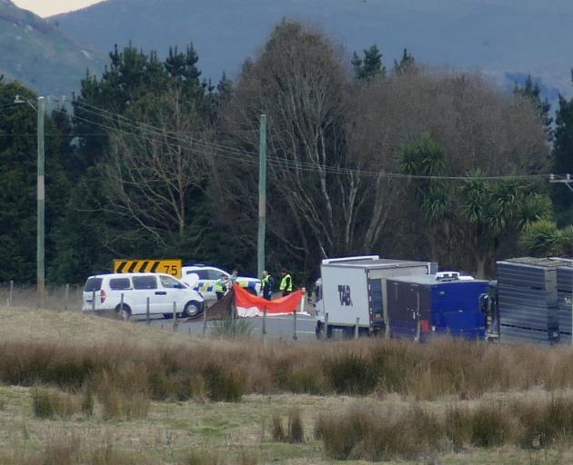 Police and emergency services personnel attend the site of a fatal accident 1km west of the...