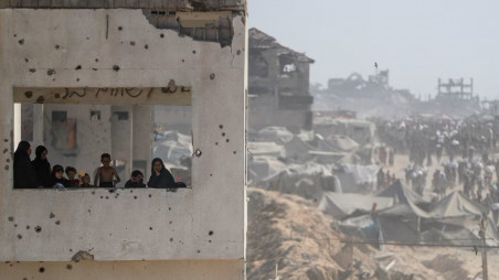 Women and children look out from a damaged building as Palestinians carry aid supplies that entered Gaza through Israel, in Beit Lahia, northern Gaza Strip, August 2, 2025. Photo: Reuters