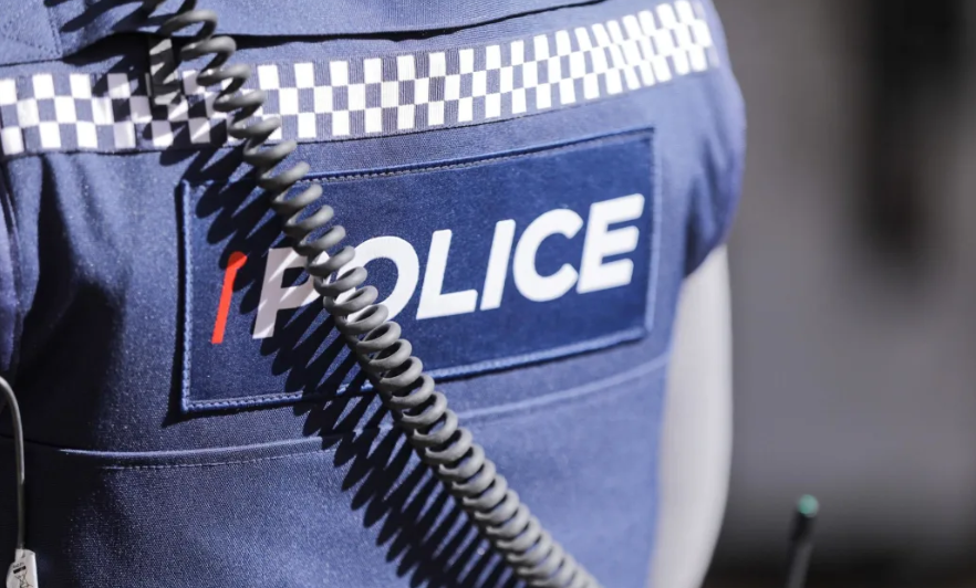 Man spat on officer after failed headbutt: police