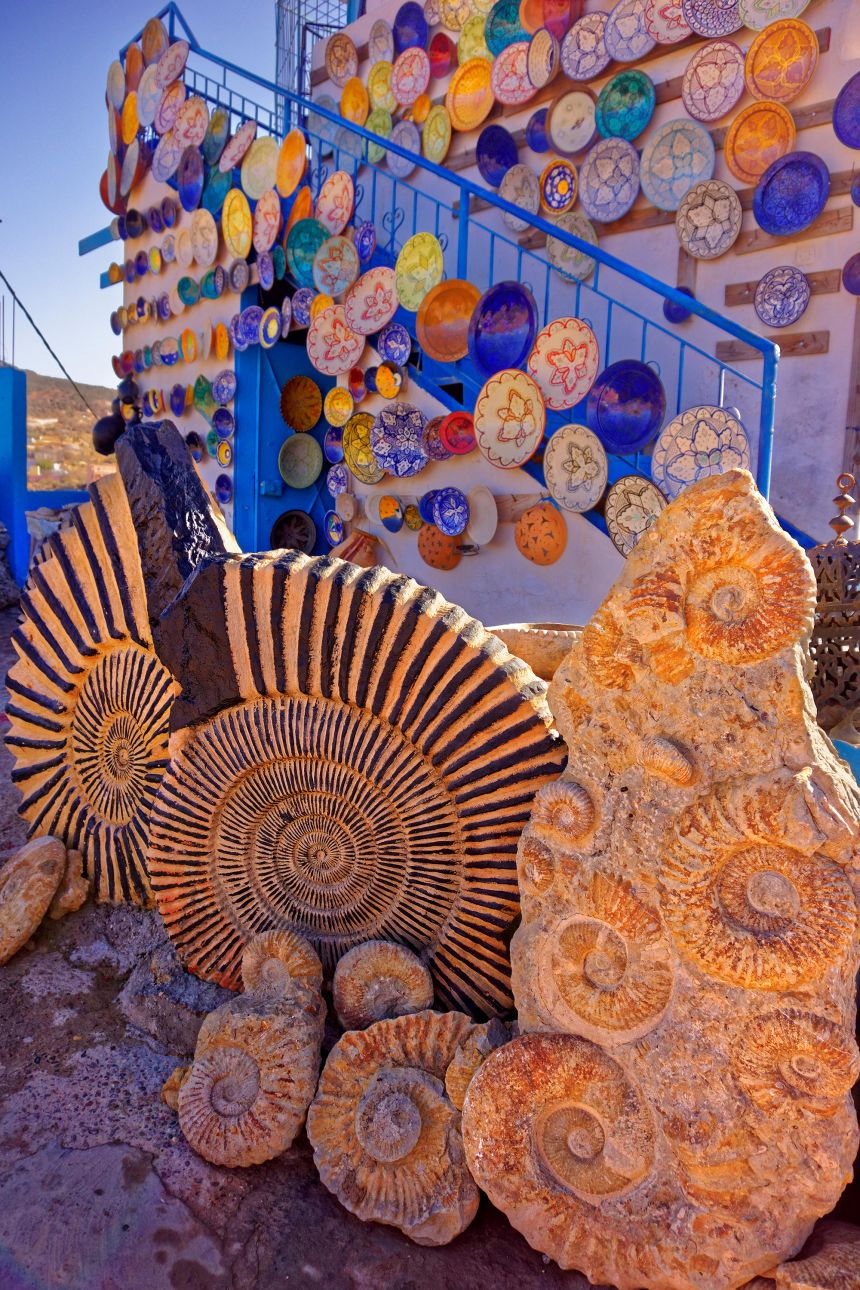 Agadir ammonite fossils are sold with pottery at a shop north of Agadir, Morocco.