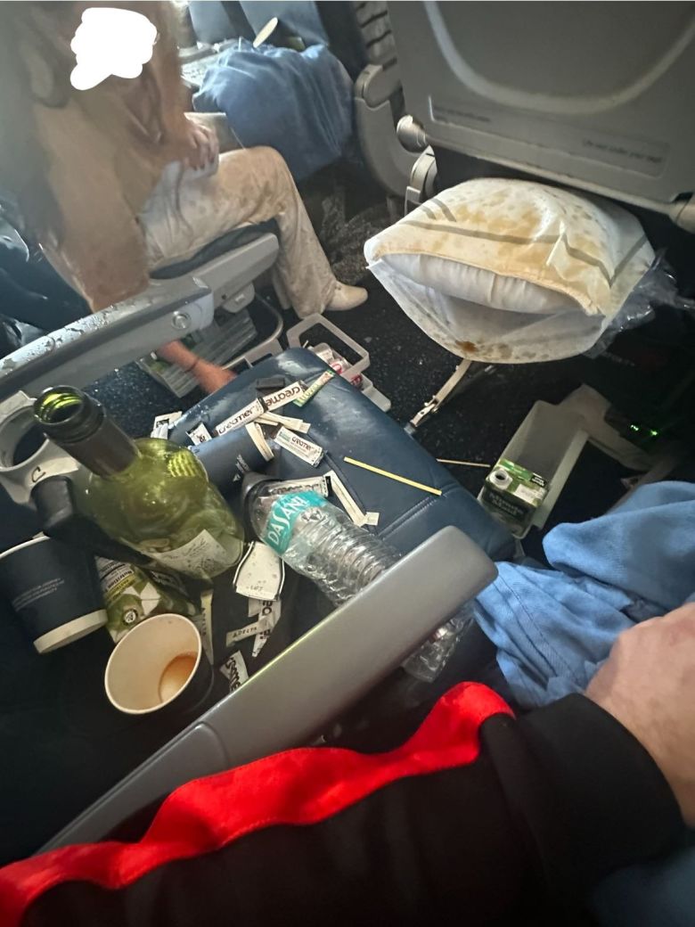 Service cart items litter the cabin after turbulence on the Delta flight.