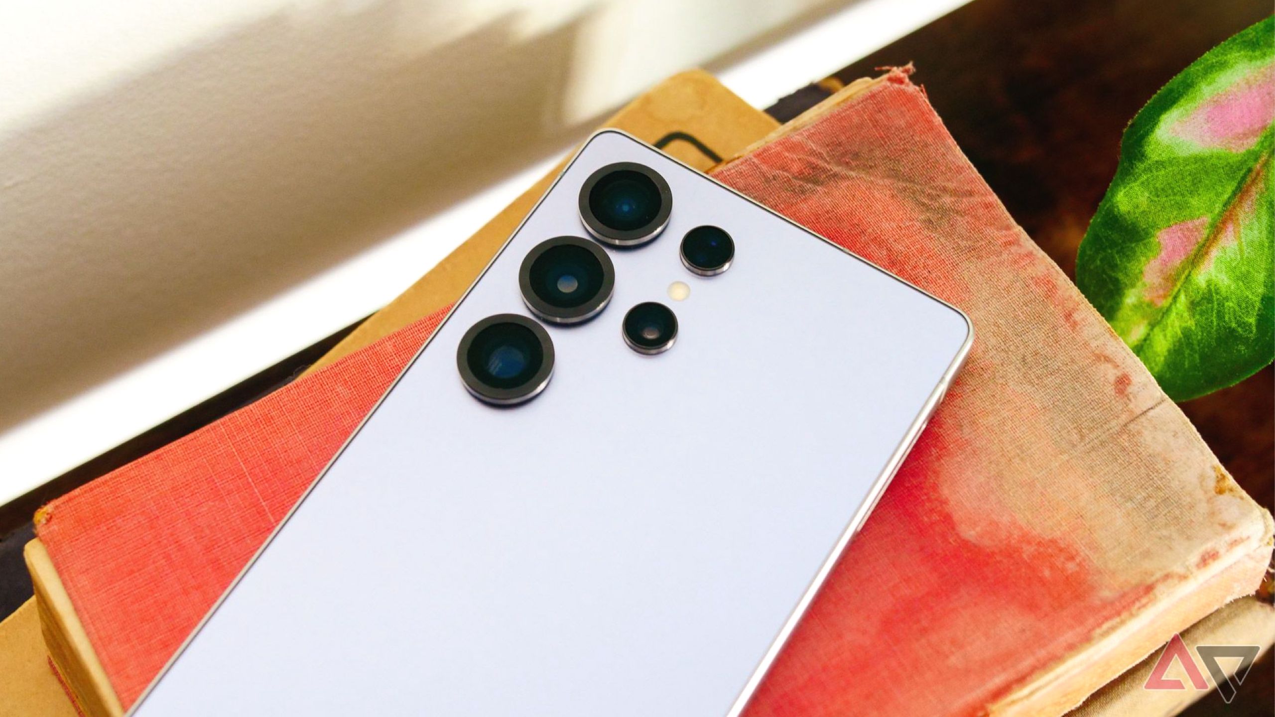 Samsung Galaxy S25 Ultra face down on top of books