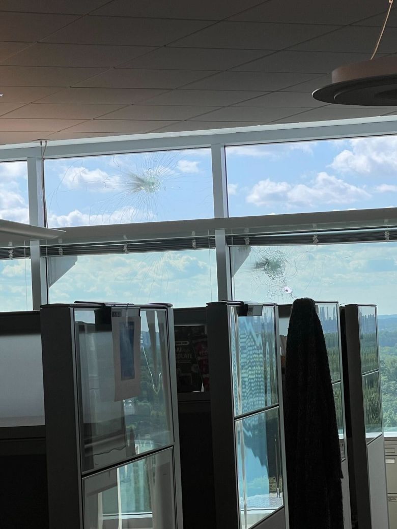 A CDC employee shared these photos with CNN that show bullet holes in glass windows at building 24 of the CDC on Friday.
