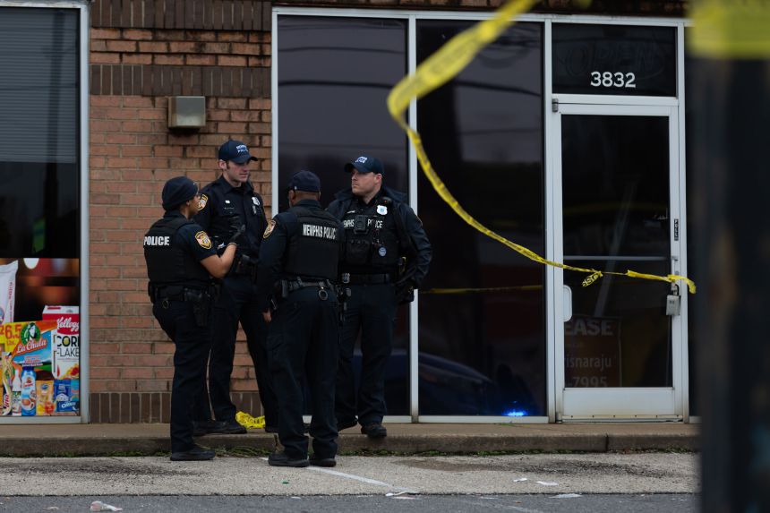 Memphis Police officers talk at the scene of a homicide scene in February 2024.