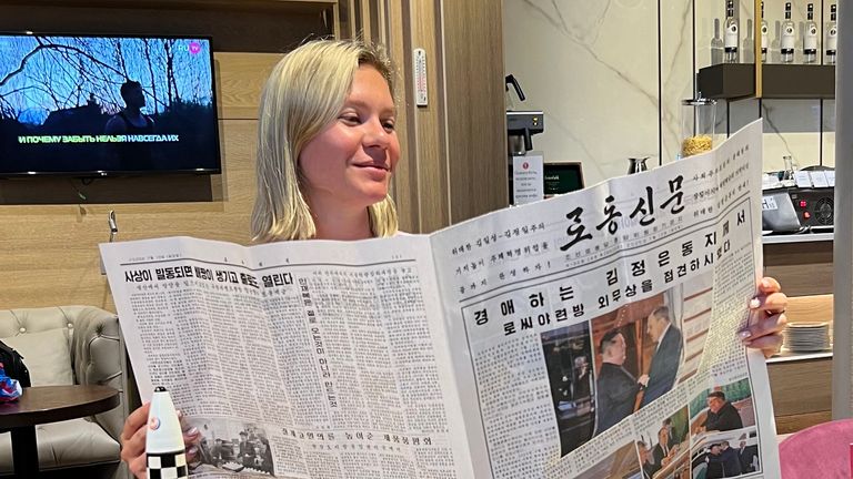 Russian tourist Anastasiya Samsonova reading a North Korean newspaper. Pic: Anastasiya Samsonova