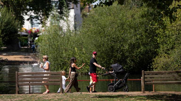 People enjoy the weather in Barnes on Monday. Pic: PA