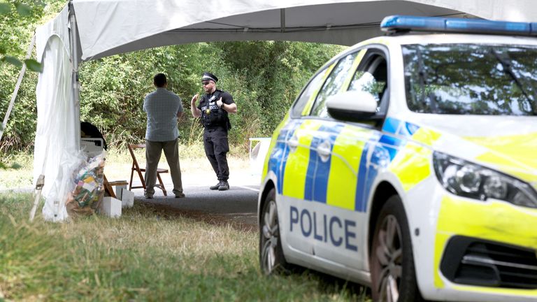 A police officer and a member of US security man a checkpoint and where a road closure was in place as JD Vance spends his holiday nearby. Pic: Reuters
Pic: Reuters