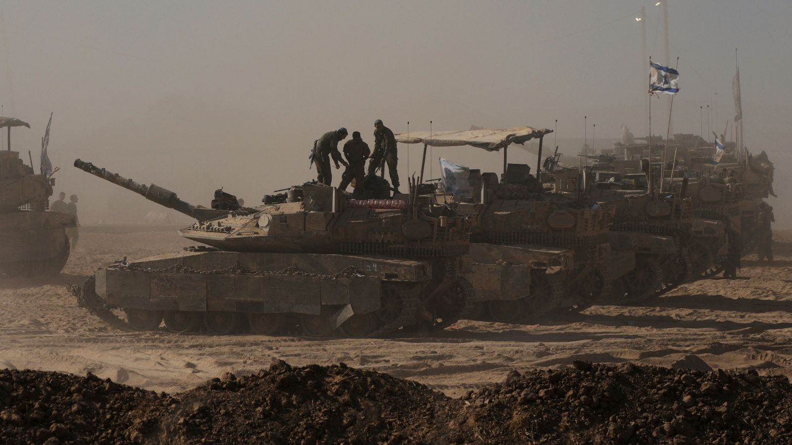 Tanks positioned near the Israeli-Gaza border, ahead of Israeli plans to reoccupy Gaza City. Pic: AP