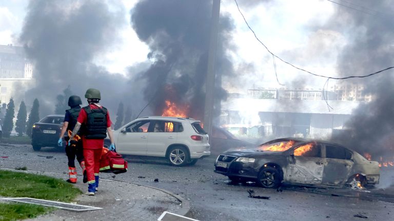 Burning cars are seen at the site of a Russian air strike, amid Russia's attack on Ukraine, in Kharkiv, Ukraine July 24, 2025. REUTERS/Sofiia Gatilova