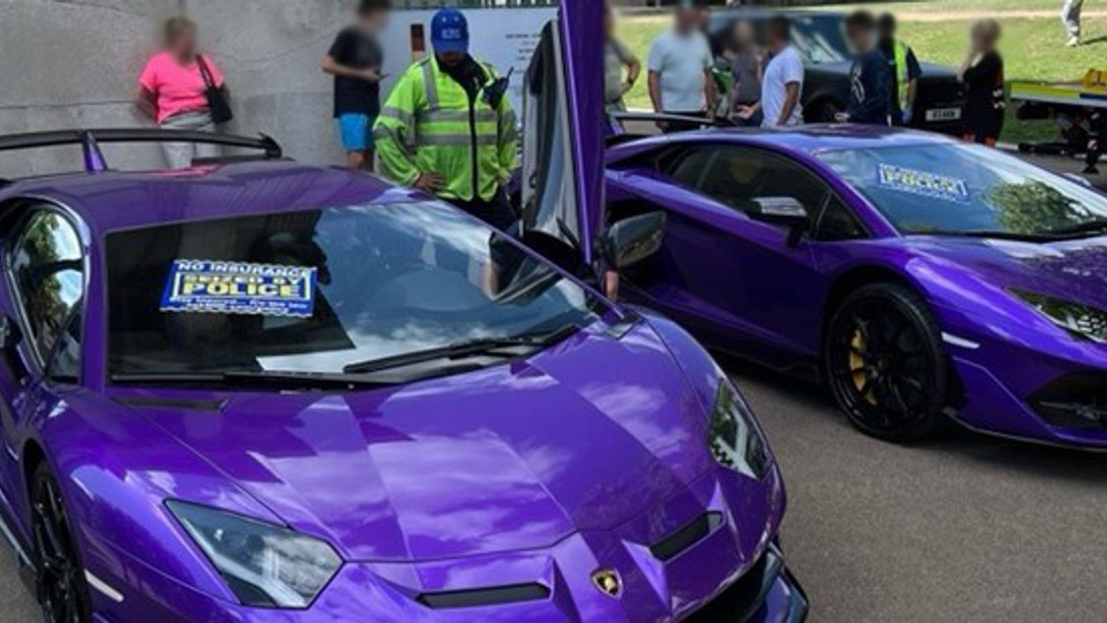 A pair of identical uninsured purple Lamborghinis seized by police during the raid. Pic: MIB