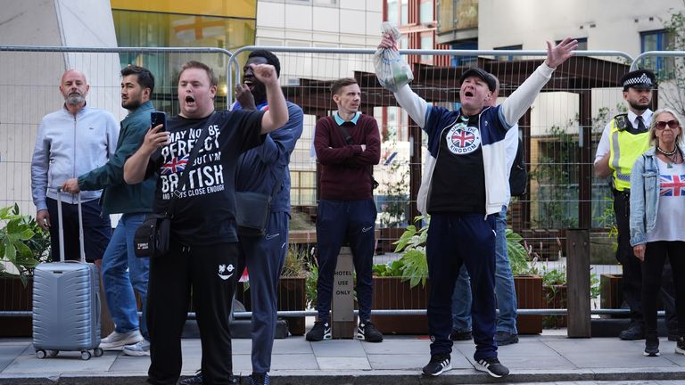 People protest outside the Britannia International Hotel in Canary Wharf. Pic: PA