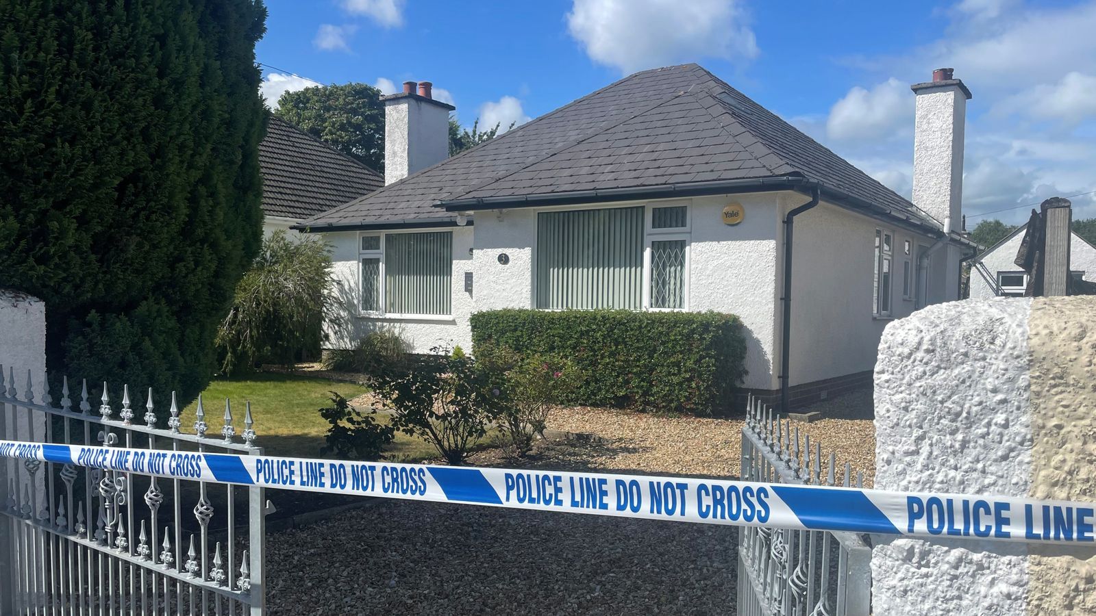 The victim's house and another property have been sealed off by police. Pic: PA