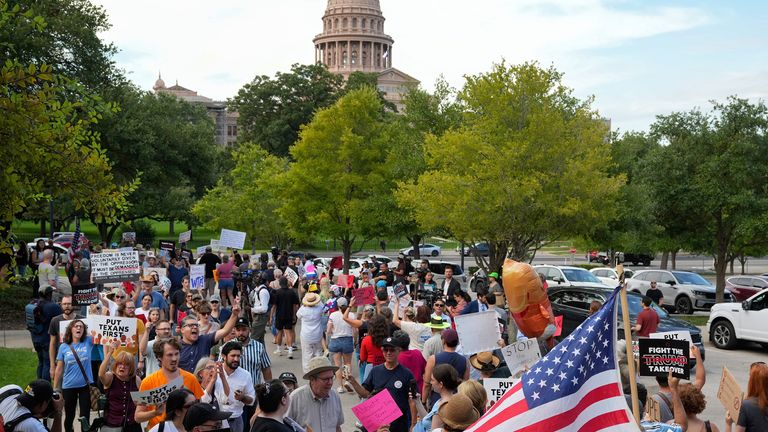 People protest the Republican plan for Congressional redistricting at the Governor's Mansion, Austin, Texas. Pic: AP